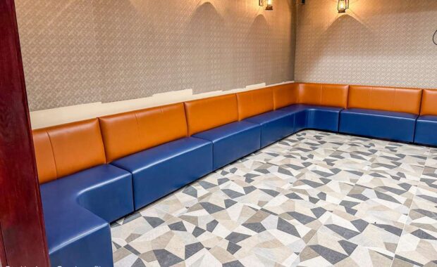 orange and blue Custom banquette seating along wall