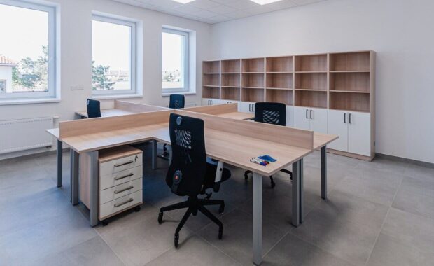 small new empty office space with desks and chairs - commercial casework