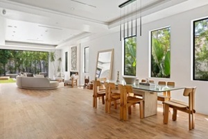 stunning indoor-outdoor estate with lush landscaping