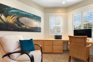 comfortable home office featuring a chair, a desk, and a computer