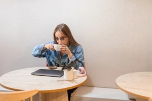office interior with armchair and table, cabinet and panoramic window