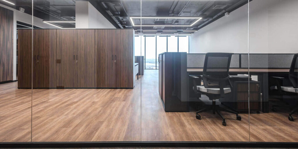 open office space featuring wooden accents and modern commercial millwork design furniture