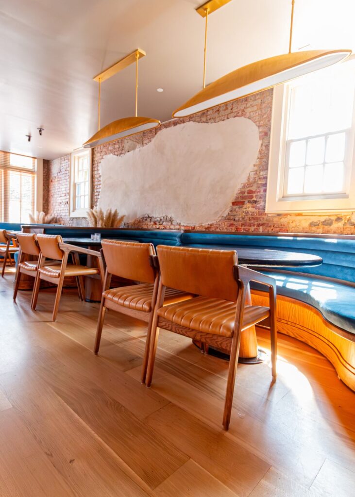 Custom wood tables and upholstered dining chairs in Florer&iacute;a, Washington, DC.