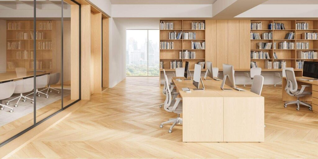 modern interior design of open office space with wooden furniture, large bookshelves, and city view through glass wall in bright natural lighting
