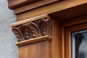 ornate wooden window trim with intricate carvings and details