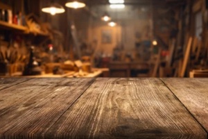 blur craft workshop interior and empty wooden table top with space for products