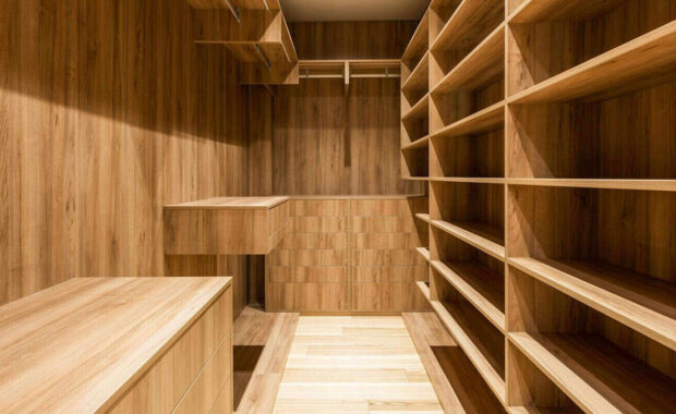 empty wooden walk-in closet interior with contemporary shelving and natural light