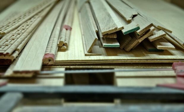 woodworking tools and wooden planks on a workbench
