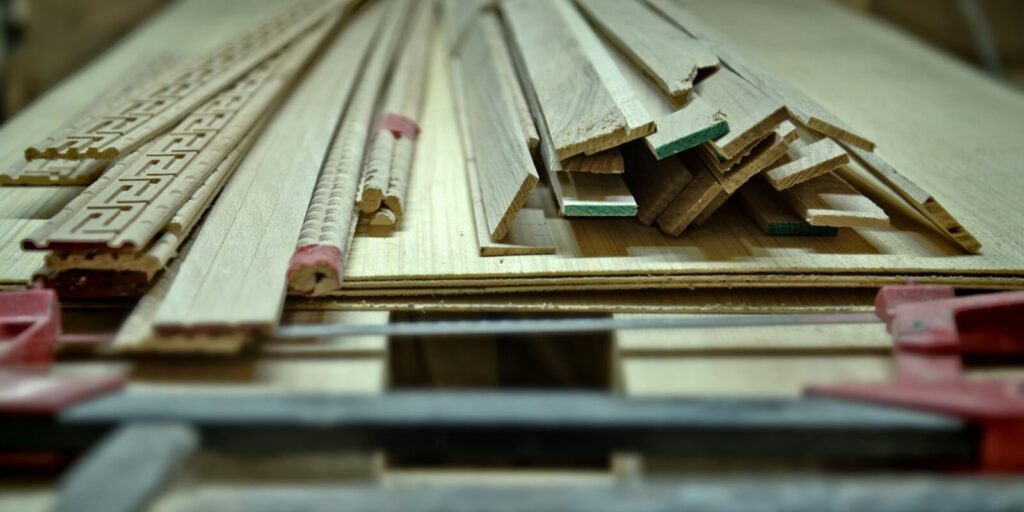 woodworking tools and wooden planks on a workbench
