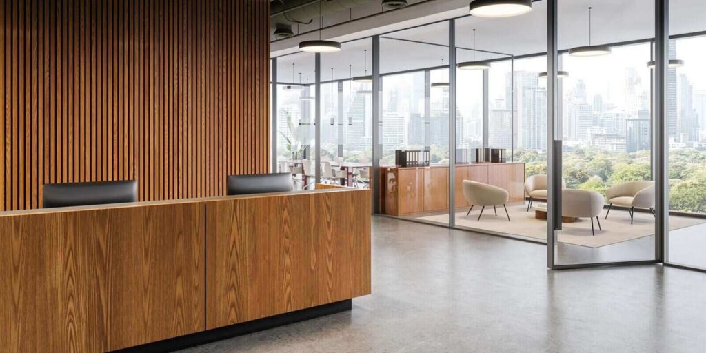 contemporary office interior with wooden reception desk and glass meeting room overlooking city skyline in bright daylight setting