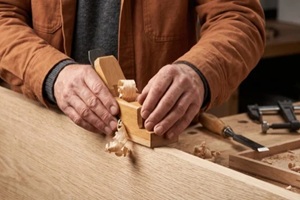 artisan oak joinery panel shaping for contemporary home interior craftsmanship