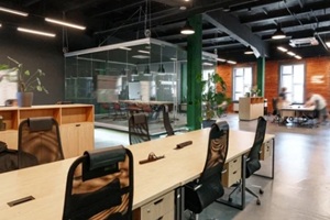 modern coworking space with open layout and glass meeting rooms in a city