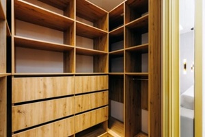 upscale walkin closet featuring natural materials and efficient layout