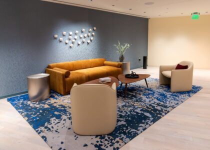 This additional lounge vignette at 1425 NY Ave showcases a more vibrant and artistic side of the project, using bold color blocking and abstract patterns to create a distinct sub-zone.